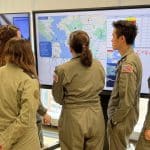 Team prepares before a drill